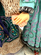 Detail: the two figures holding hands (detail from seller photo)