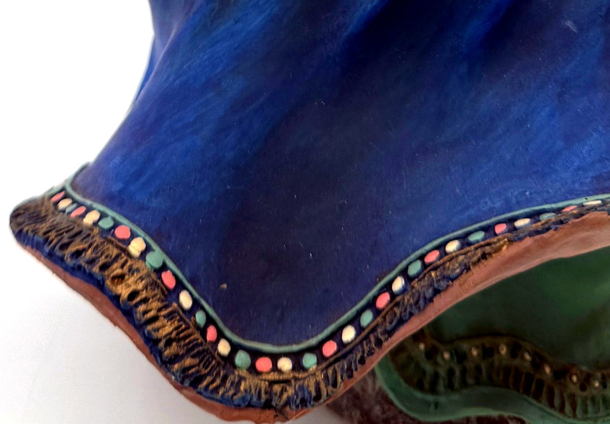 Detail: windblown coat hem with beaded trim (detail from seller photo)