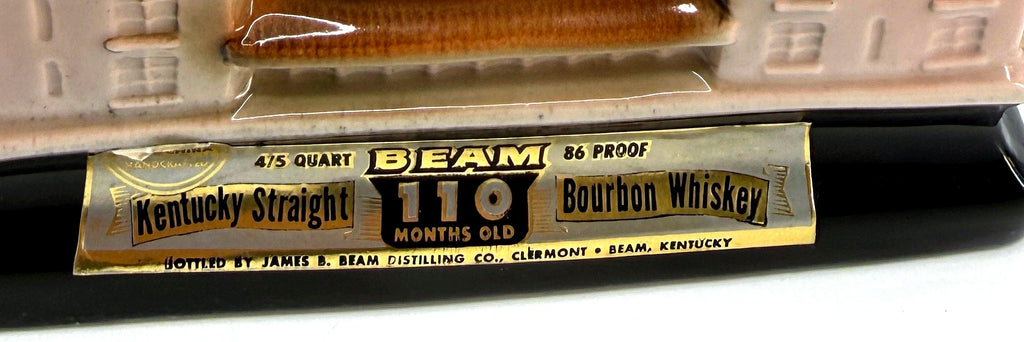 Detail crop of the original foil label band on the decanter base