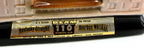 Detail crop of the original foil label band on the decanter base