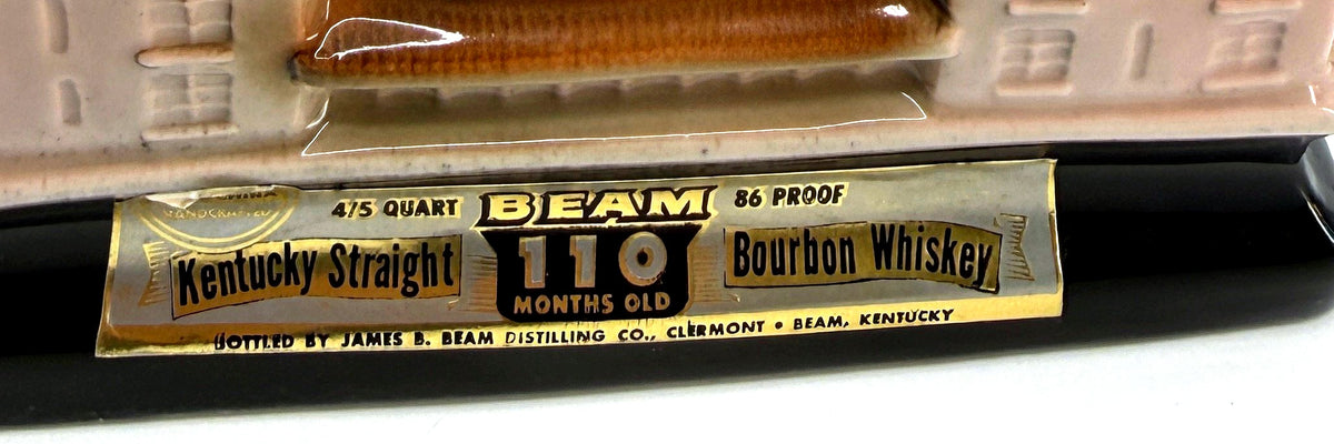 Detail crop of the original foil label band on the decanter base