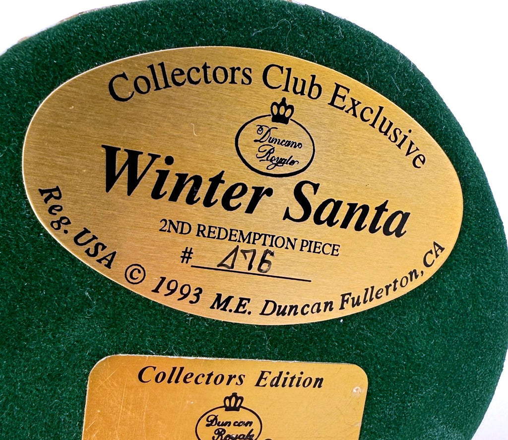 Detail crop — the gold base labels: Winter Santa, Collectors Club Exclusive, 2nd Redemption Piece, © 1993 M.E. Duncan, Fullerton CA