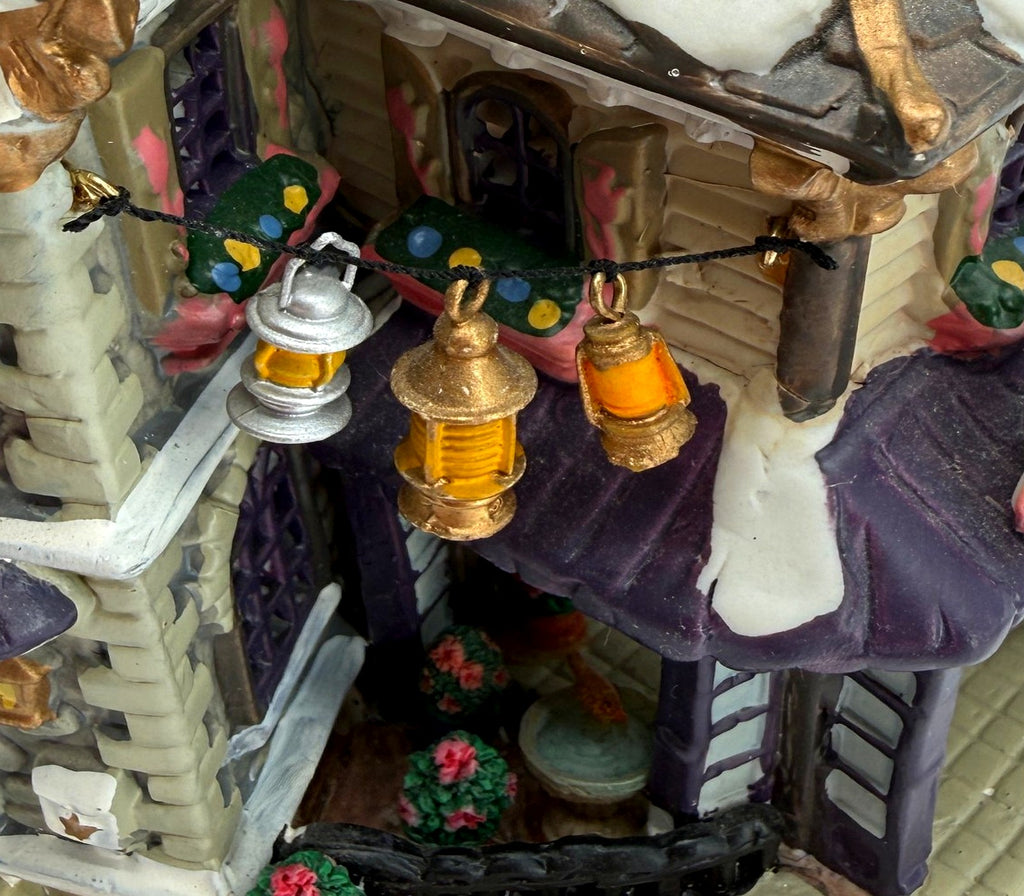 Detail crop: hanging lanterns over the garden courtyard (enhanced photo)
