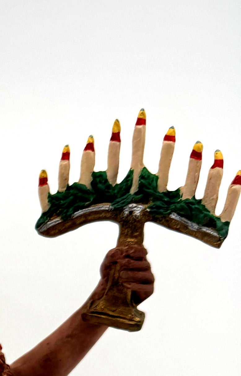 Detail: raised Hanukkah menorah with nine candles (detail from seller photo)