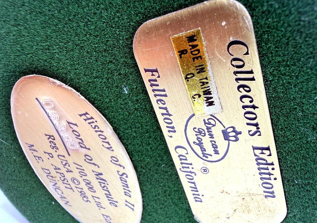 Detail: Duncan Royale underside plaques, History of Santa II Lord of Misrule (detail from seller photo)