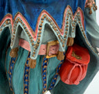 Vintage 1985 Duncan Royale Sir Christmas figurine – detail of the red drawstring pouch, pink sash with gold buckle, and scalloped cape trim with gold dots