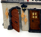 Department 56 Dickens' Village Poulterer 1988 lighted porcelain poultry shop — detail: dressed poultry hanging by the arched side door and front door
