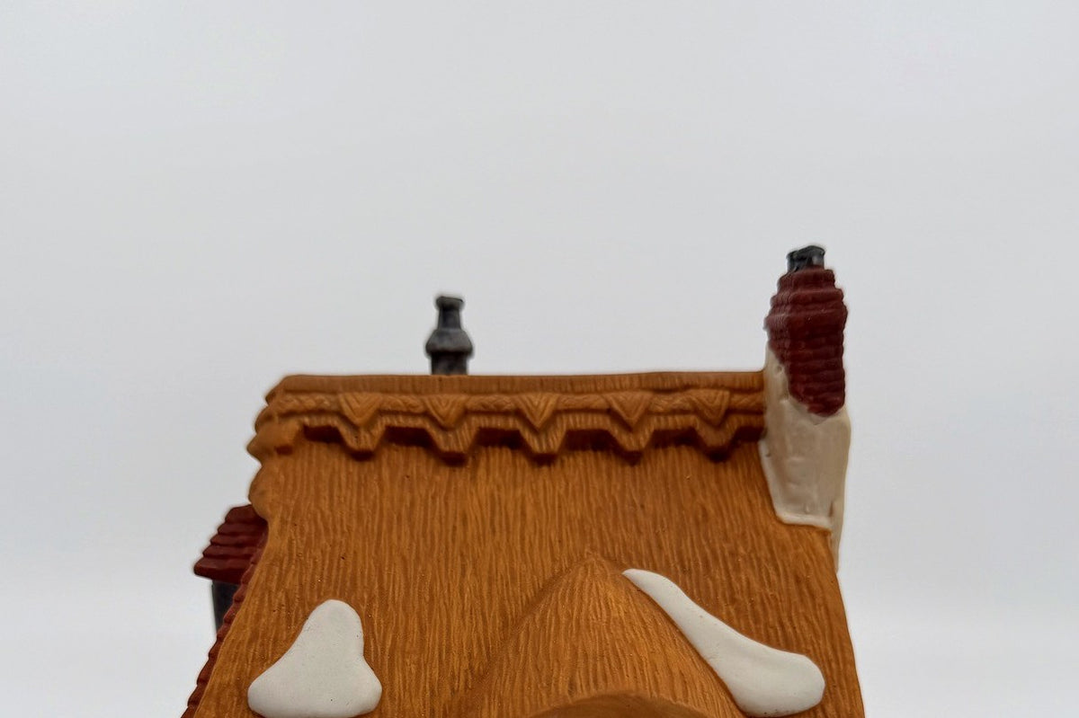 Department 56 Dickens' Village Betsy Trotwood's Cottage #5550-6, David Copperfield — detail: thatched roof with snow patches and brick chimney