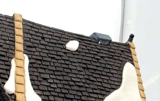 Department 56 Dickens' Village Butter Tub Barn #58338 – detail: dark shingle roof with snow patches