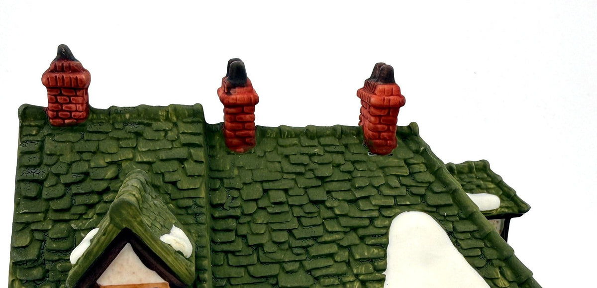 Detail - green shingle roof and brick chimneys