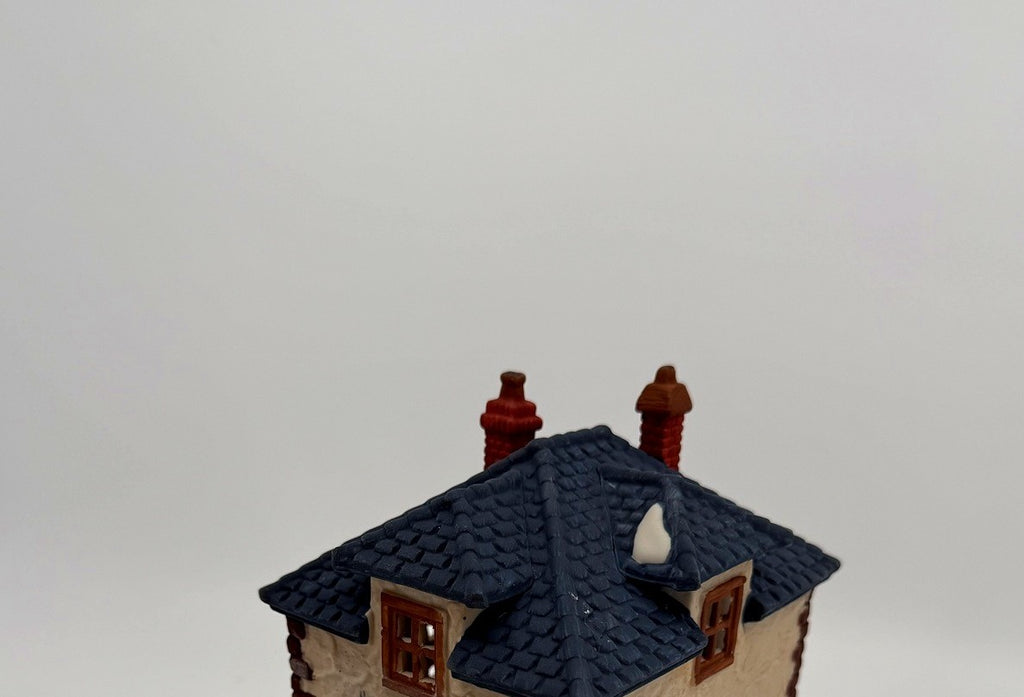 Department 56 Dickens' Village Walpole Tailors #5926-9 — detail: navy-blue roof and twin brick chimneys