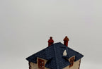 Department 56 Dickens' Village Walpole Tailors #5926-9 — detail: navy-blue roof and twin brick chimneys