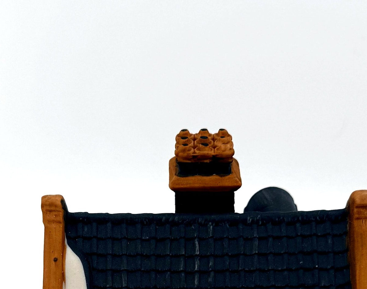 Detail - slate-style roof with snow and chimney