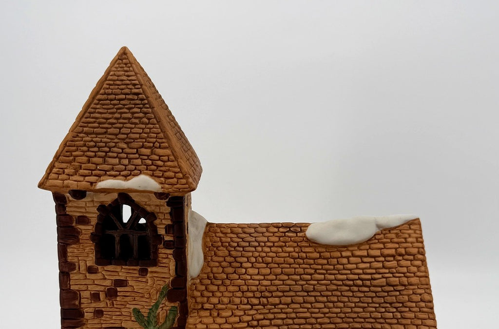 Department 56 Dickens' Village Church – detail of the shingled roofline with snow patches