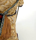 Detail crop — the gift sack's patterned drum and sculpted gifts
