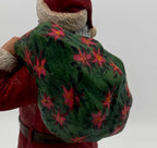 Vintage 1994 Duncan Royale Santa's Gift figurine – detail of the hand-painted poinsettia pattern on the gift sack