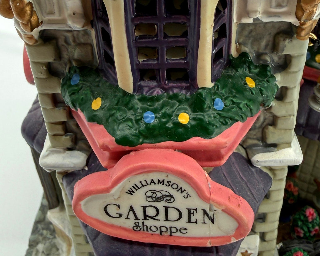 Detail crop: Williamson's Garden Shoppe sign and garland (enhanced photo)