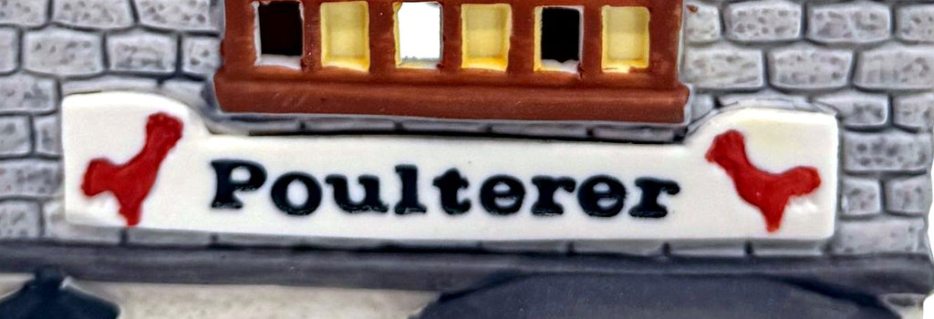 Department 56 Dickens' Village Poulterer 1988 lighted porcelain poultry shop — detail: Poulterer sign with two red rooster silhouettes