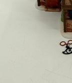 Department 56 Dickens' Village T. Puddlewick Spectacle Shop #58334 — detail: the separate hanging spectacles sign and bracket