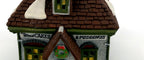 Wm. Wheat Cakes & Puddings #5808-7 — detail: shop signs, wreath and front door