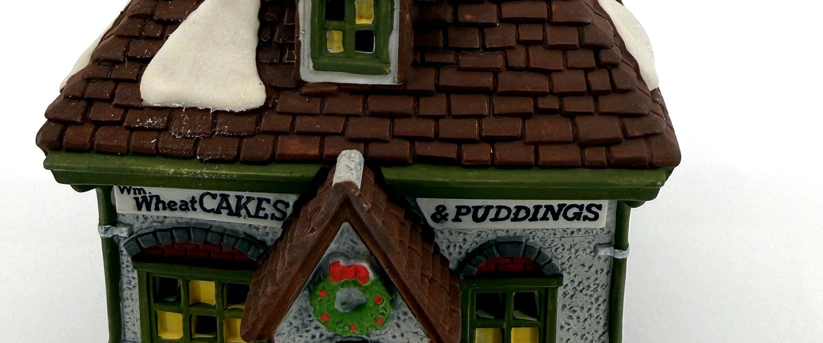 Wm. Wheat Cakes & Puddings #5808-7 — detail: shop signs, wreath and front door