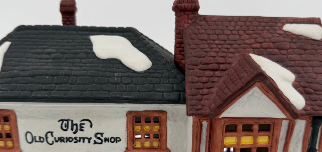 Department 56 Dickens' Village The Old Curiosity Shop #5905-6 — detail, hand-lettered sign and Christmas garland