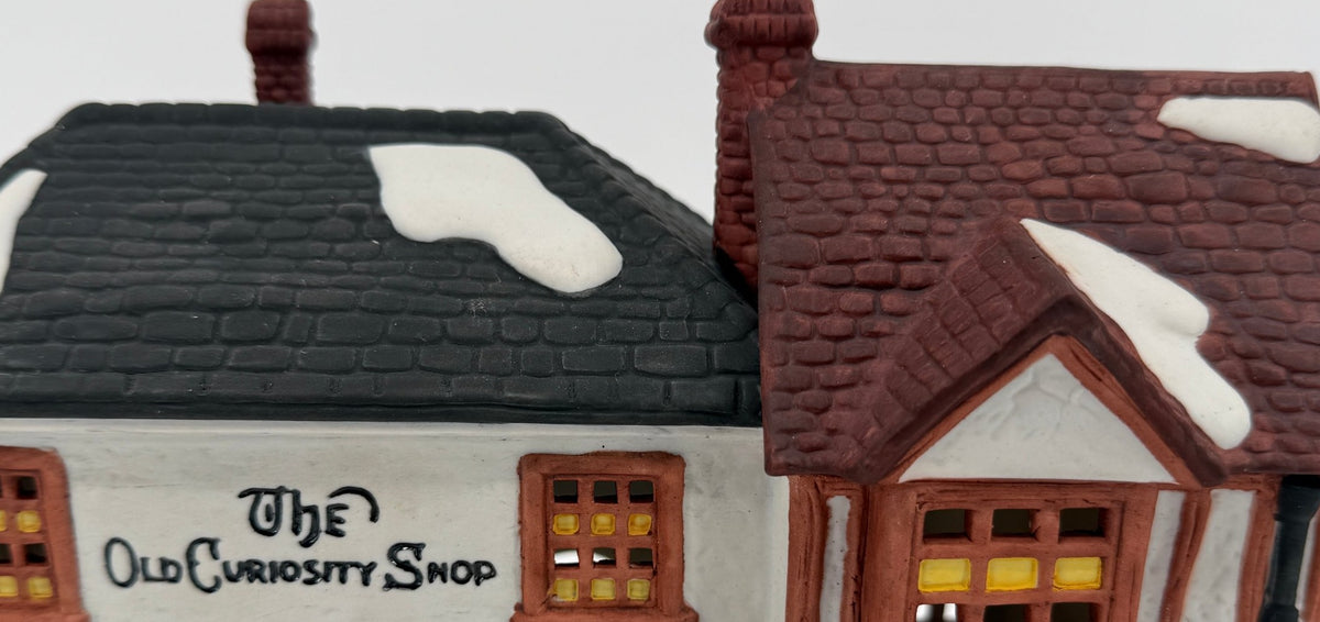 Department 56 Dickens' Village The Old Curiosity Shop #5905-6 — detail, hand-lettered sign and Christmas garland