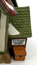 Department 56 Dickens' Village Hembleton Pewterer 1992 #5800-9 – detail of the Tom Hawkins Chimney Sweep sign on the brick side annex