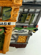 Detail of the Silas Thimbleton oval sign and hand-painted Tudor wing