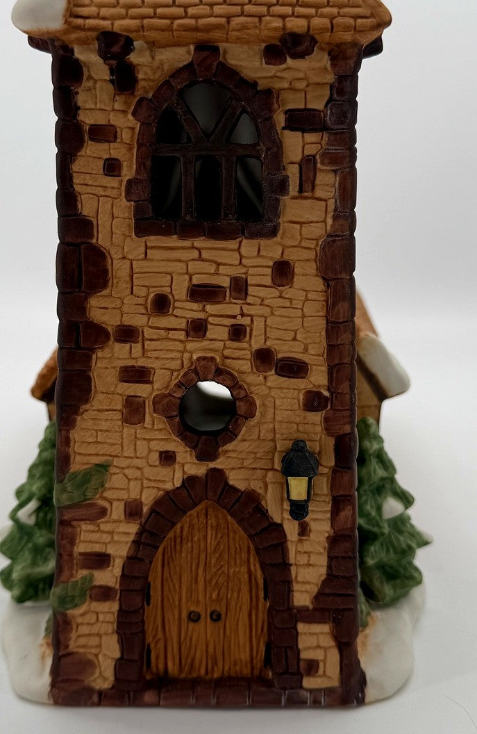 Department 56 Dickens' Village Church – detail of the tower window, sculpted stonework and wooden door