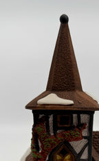 Department 56 Dickens' Village Old Michaelchurch 1992 lighted porcelain church — detail: spire, black finial and red-and-green ivy on the tower