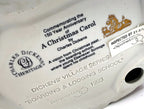 Department 56 Dickens' Village Boarding & Lodging School 1993 #5809-2 – 150th Anniversary of A Christmas Carol Commemorative Edition, No. 18 – detail of the printed underside text commemorating the 150th anniversary of A Christmas Carol, with the Charles Dickens Heritage logo