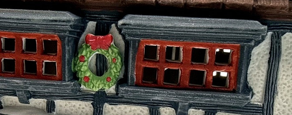 Department 56 Tutbury Printer, Dickens' Village, 1990 – detail: Christmas wreath between the upper windows