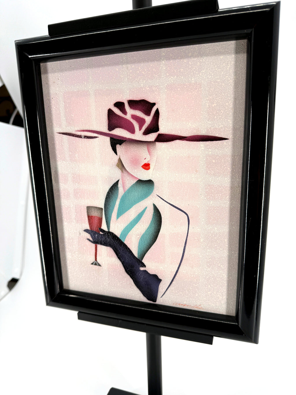 Vintage 1993 Art Deco-style fashion lady framed wall art — angled front view showing the glossy black frame
