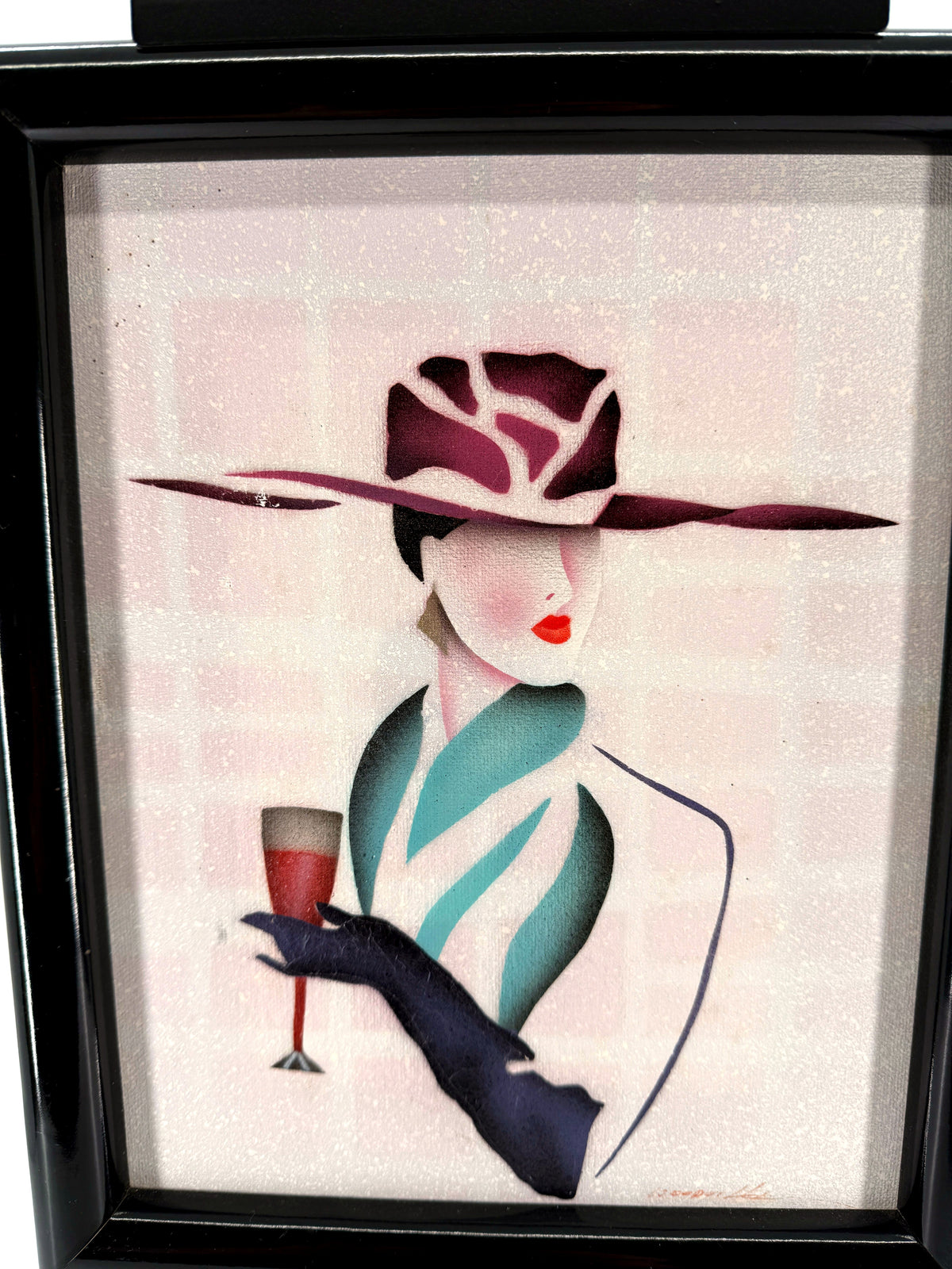 Vintage 1993 Art Deco-style fashion lady framed wall art — front detail of the hat, teal wrap and champagne glass