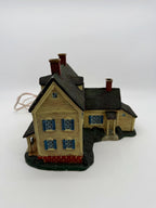 Gable end and side wing with shuttered windows and brick foundation