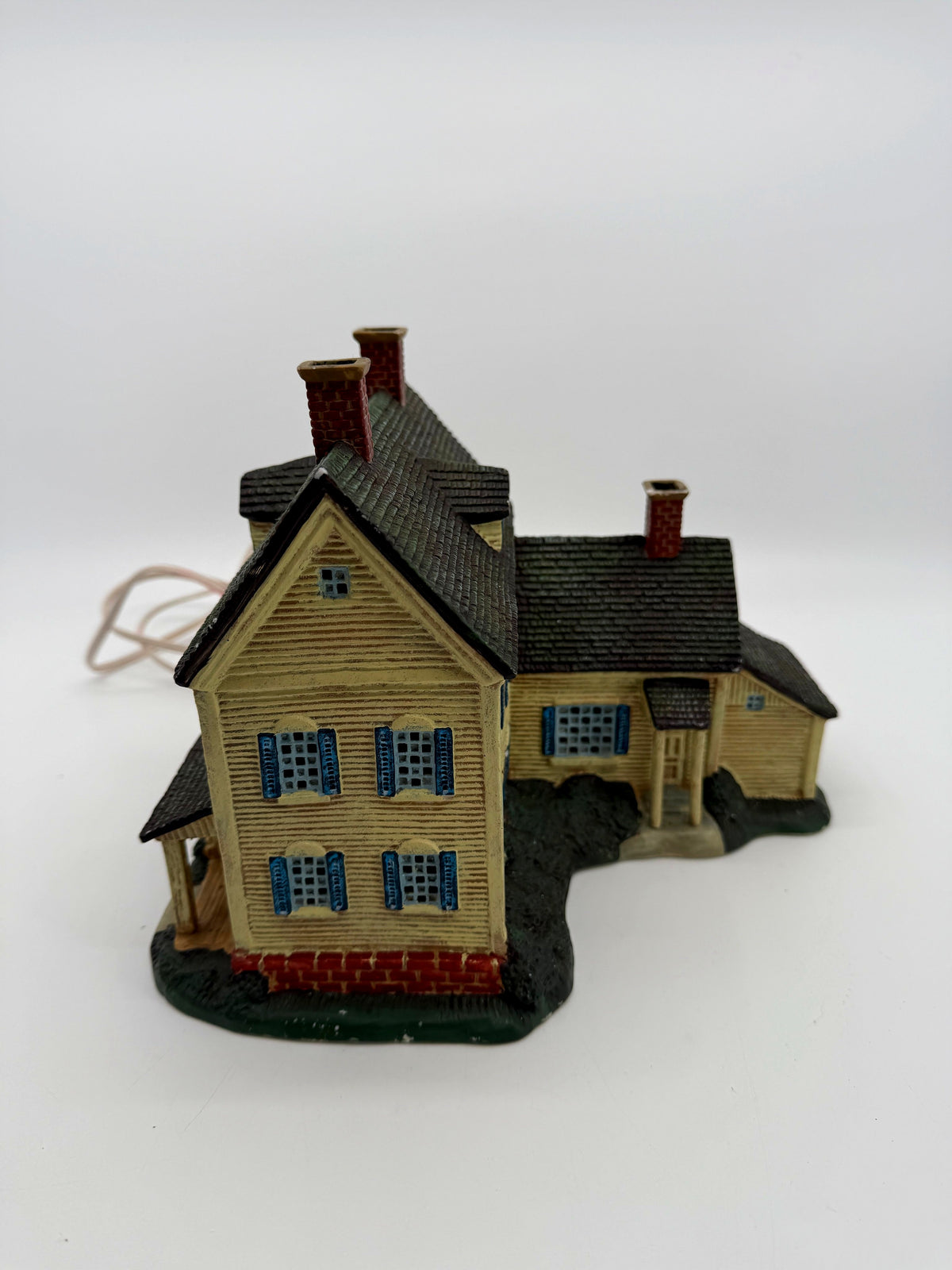 Gable end and side wing with shuttered windows and brick foundation