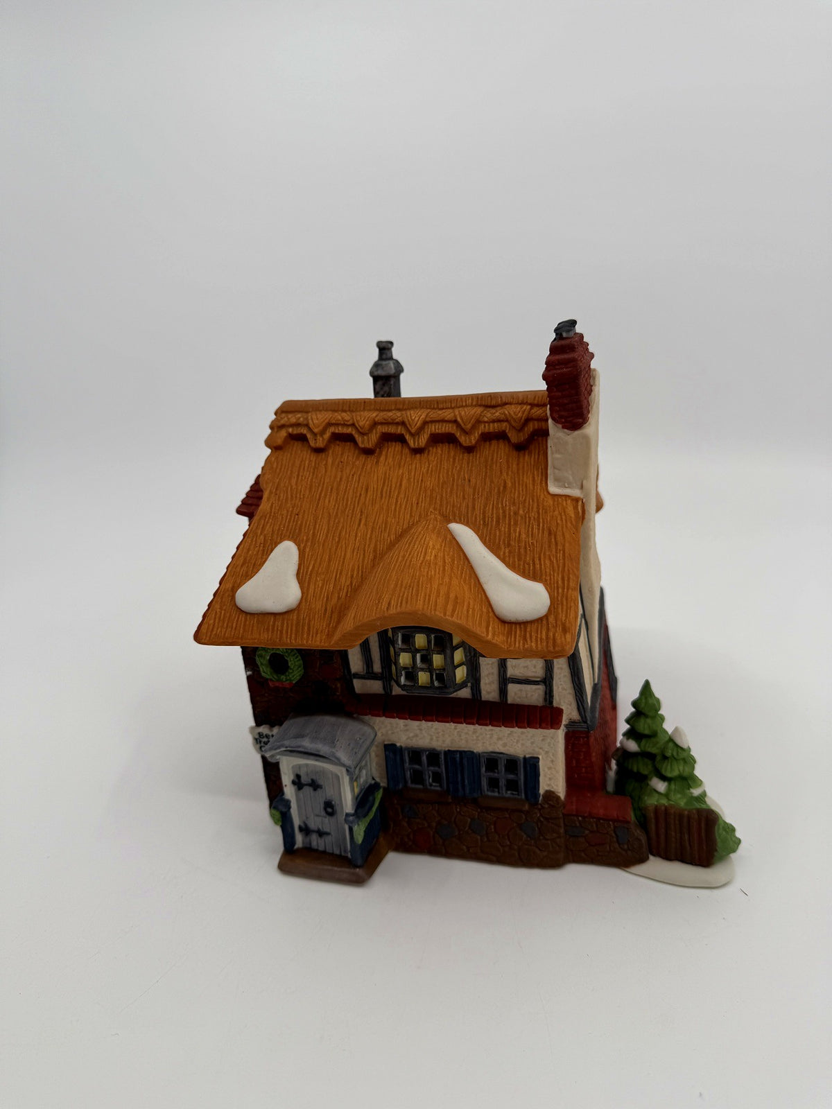 Department 56 Dickens' Village Betsy Trotwood's Cottage #5550-6, David Copperfield — front three-quarter view showing the thatched roof and pine trees