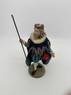 Vintage 1985 Duncan Royale Sir Christmas figurine – front three-quarter view with his original removable staff: royal blue scalloped cape, white lace ruff collar, holly wreath and red drawstring pouch; History of Santa Claus II limited edition of 10,000