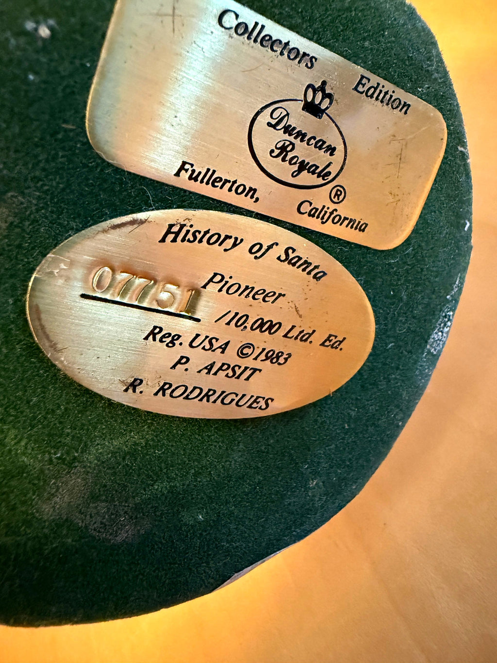 Vintage 1983 Duncan Royale Pioneer Santa figurine – underside of base with gold Duncan Royale plates: Collectors Edition, Fullerton, California, and History of Santa Pioneer No. 07751 of 10,000