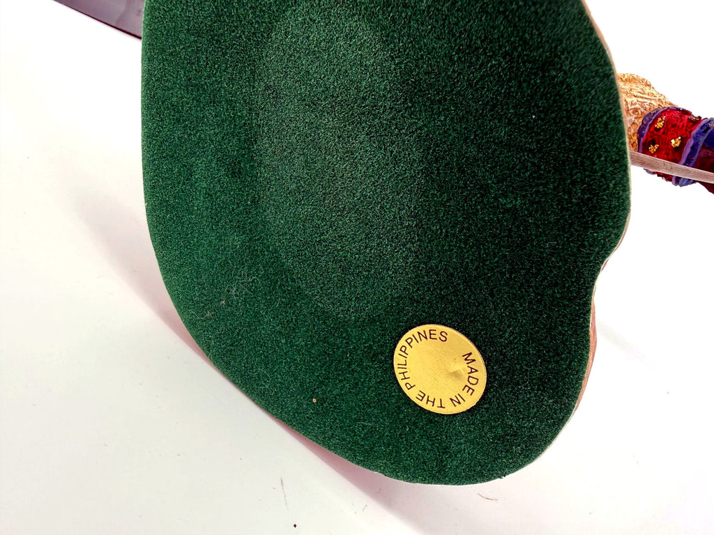 Underside of the base — green felt with the gold Made in the Philippines sticker; the original numbered label is no longer present