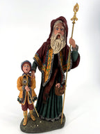Duncan Royale Star Man figurine, History of Santa III, 1990 — full front view with the child, both holding gold ceremonial staffs