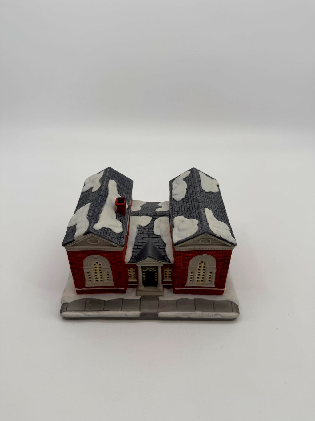 Front view from above showing the snow-covered slate roofs