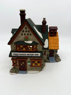 Front view of the Giggelswick Mutton & Ham butcher shop with bay window and Christmas wreath