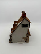 Left side - gable end with green shutters and stone detail