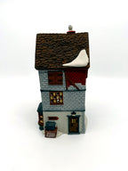 Department 56 Dickens' Village Poulterer 1988 lighted porcelain poultry shop — right side: BATH sign and wooden crate