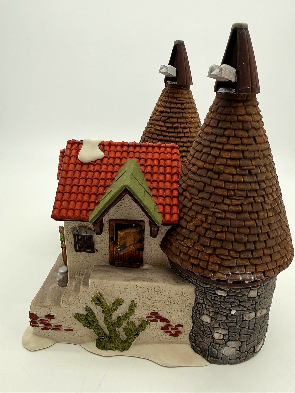 Side view showing the conical oast kilns and stone tower bases