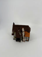 Department 56 Dickens' Village Maylie Cottage #5553-0, Oliver Twist — front three-quarter view showing the thatched roof and orange tiled roof section