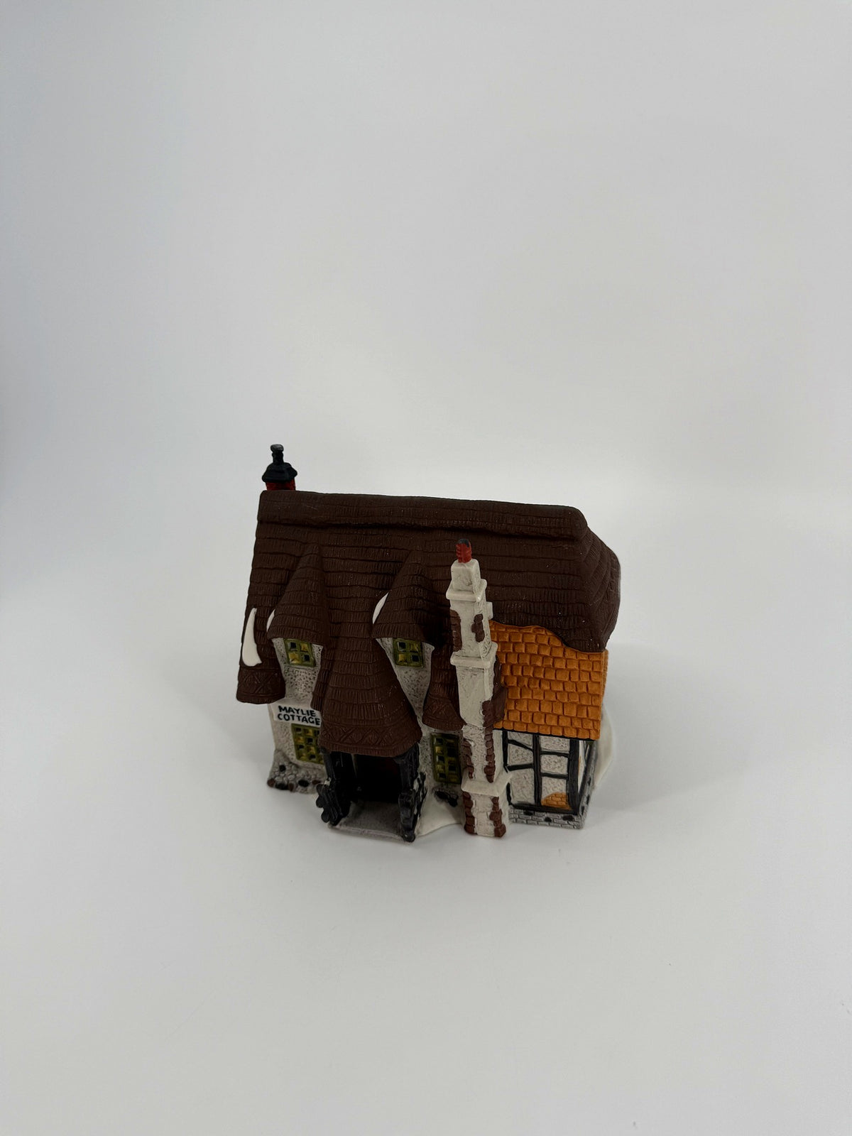 Department 56 Dickens' Village Maylie Cottage #5553-0, Oliver Twist — front three-quarter view showing the thatched roof and orange tiled roof section
