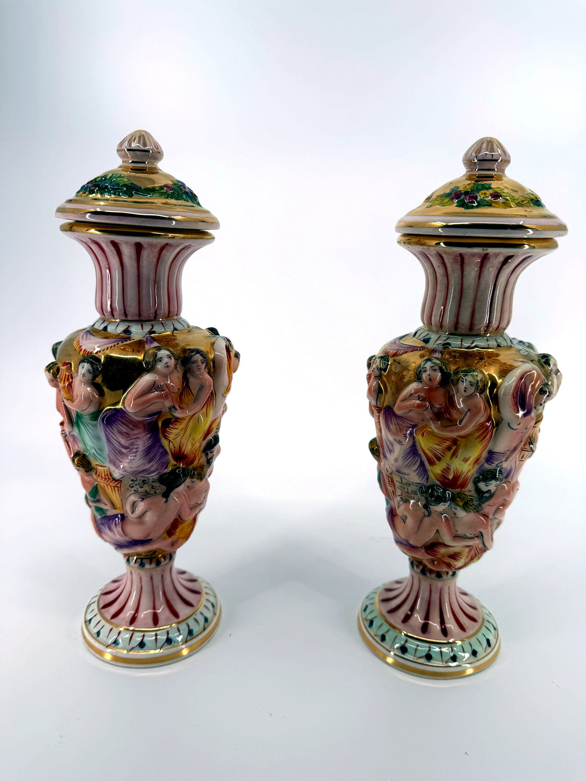 Vintage Italian Capodimonte-style figural urns, pair — the pair, front view on a white background